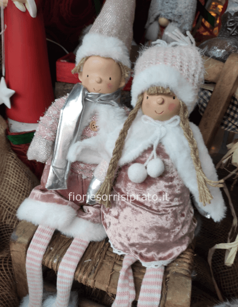 Bamboline sedute in rosa